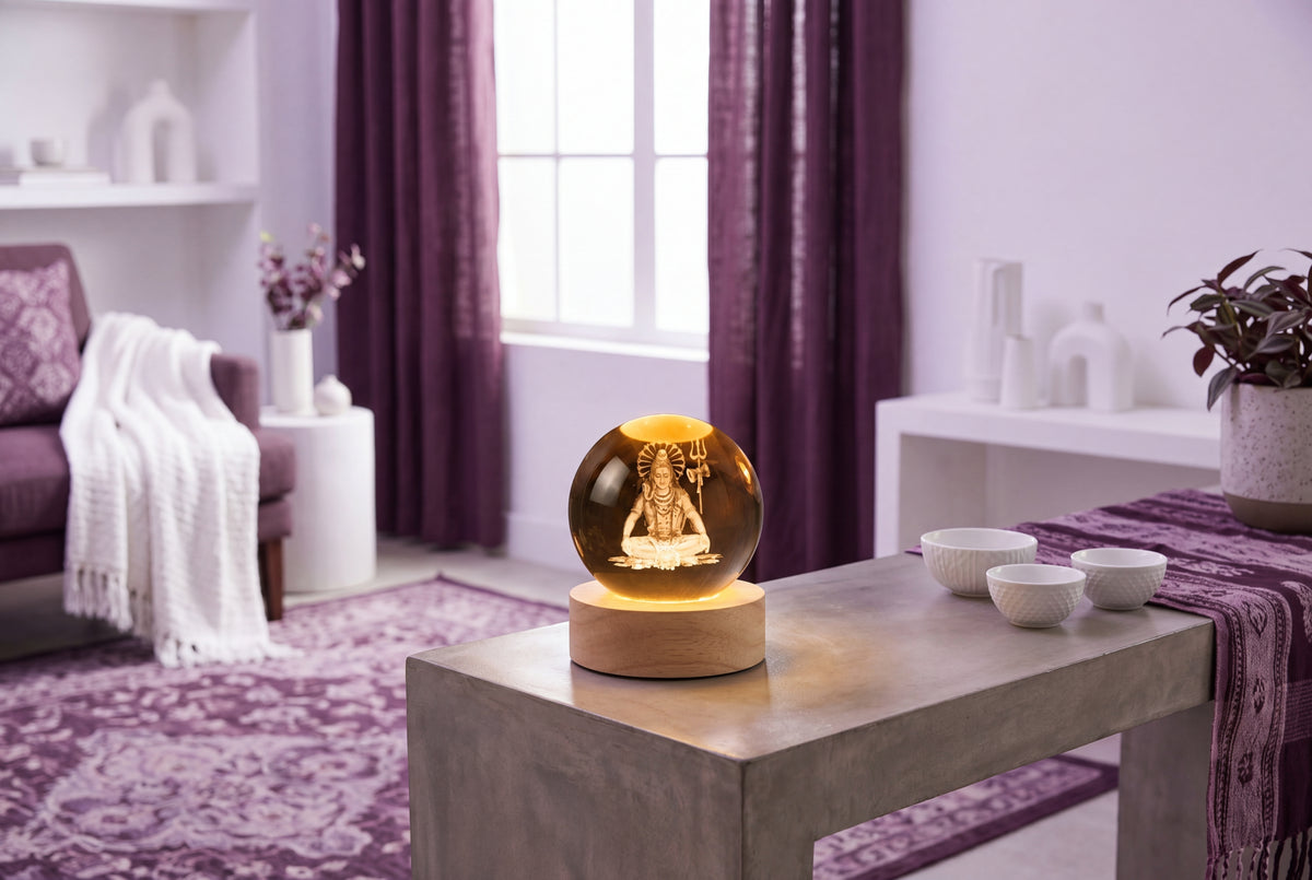 A "Mahakal Divine Glow LED Lamp" emitting a soft, positive light in a modern South Asian-inspired room with plum and lilac ac